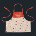 Niedliches Keks Crew Weihnachtsmuster Schürze<br><div class="desc">Die Schürze bietet ein fröhliches Weihnachtsgebäck - eine Weihnachtsmannmütze, Schneemann, Weihnachtsbaum, einen Engel, Fäuste und einen Bonbons. Der Text lautet "COOKIE TASTING CREW", aber er kann angepasst werden, um alles zu sagen, was man möchte. :) Das Rot ist eine orange - rote Farbe, der Hintergrund ist beige. Eine tolle Geschenkidee...</div>
