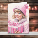 Niedliches kleines Mädchen in Pink Retro Weihnacht Karte<br><div class="desc">Hübsche Weihnachtskarte mit Aquarellfarbe. Adorable kleine Vintage Mädchen in der Wintermütze mit einer Retro-Geschenkboxen in Rosa.</div>