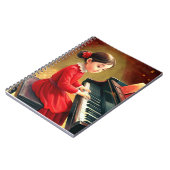 Niedliches Mädchen in roter Kleidung beim Klaviers Notizblock (Linke Seite)