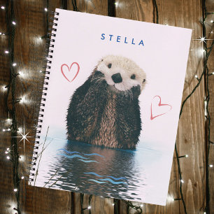 Niedliches Otter im Teich mit rosa Hintergrund und Notizblock