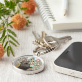 Niedliches Otter mit Eiscreme auf wirbellem Hinter Schlüsselanhänger (Seite)