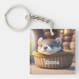 Niedliches Otterbaby in einem Korb - personalisier Schlüsselanhänger