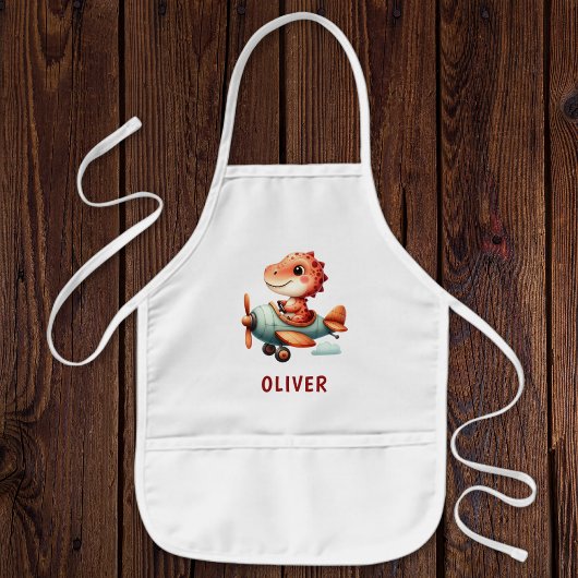 Niedliches Pilotenflugzeug mit Dinosaurier Kinderschürze