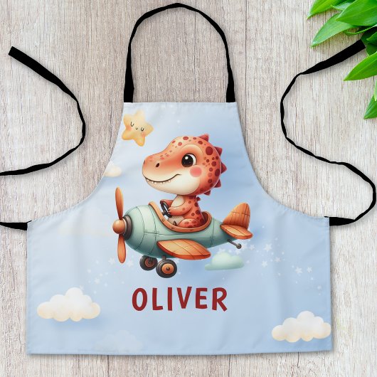 Niedliches Pilotenflugzeug mit Dinosaurier Schürze