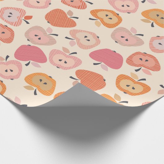 Niedliches rosa und orangefarbenes Apfelmuster Geschenkpapier (Ecke)