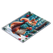 Niedliches Rotes Eichhörnchen in den Weihnachtsbal Notizblock (Linke Seite)