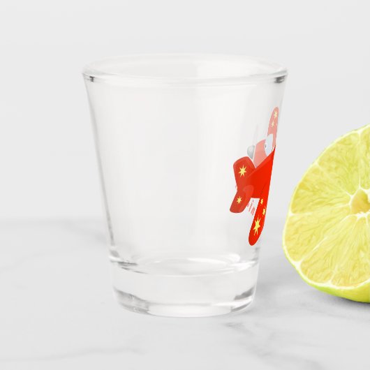 Niedliches rotes Flugzeug mit Cartoon Schnapsglas (Links)
