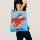 Niedliches rotes Flugzeug mit Cartoon Tasche (Von Nahem)