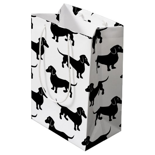Niedliches schwarzes Dackel-Muster Mittlere Geschenktüte (Rückseite Schrägansicht)