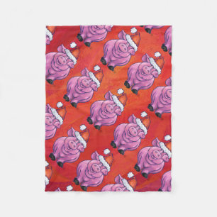 Niedliches Schwein in Weihnachtsmannmütze auf Rot Fleecedecke