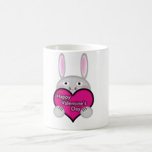 Niedliches Sonnenlicht mit rosa Valentinstag Herz Kaffeetasse