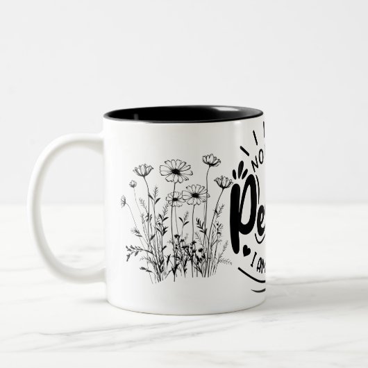 "Niemand ist perfekt: Eine spielerische Leistung a Zweifarbige Tasse (Links)