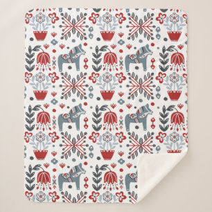 Nordisches Pony und Blumenmuster in Grauem und in Sherpadecke