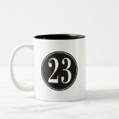 Nr. 23 - Schwarzer Kreis (Front) Zweifarbige Tasse (Links)