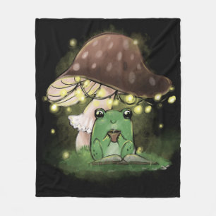 Nur ein kleiner Frosch, der ein Buch unter einem P Fleecedecke