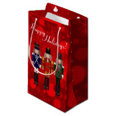 Nutcracker Trio-Red Bokeh-GIFT BAG S Kleine Geschenktüte (Vorderseite Schrägansicht)