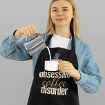 Obsessiver Kaffeeausfall | Niedlich Barista Schürze<br><div class="desc">Diese lustige Kaffee-Liebhaber-Schürze bietet eine Tasse dampfenden Java über den niedlichen Worten Obsessive Kaffeekrankheit. Eine coole Schürze für ein Barista.</div>