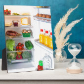 Offener Kühlschrank mit Essen Fotoplatte (Seite)