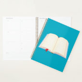 Offenes Linienbuch mit rotem Lesezeichen Planer (Anzeige)