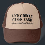 Official Lucky Ducky Trucky Hat-Words only Truckerkappe<br><div class="desc">the official Trucky Hat worn by legends, dreamers, and Quack Pack members everywhere. This ain’t your average cap. This is a brown-and-khaki crown of grit, embroidered in bold old gold with our Lucky Ducky logo — forged somewhere between Eastbound & Down and a Nebraska sunrise. Whether you’re loaded up and...</div>