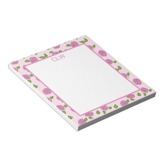 Öffnen Sie die Blume Pink auf dem hellrosa Notepad Notizblock (angewinkelt)