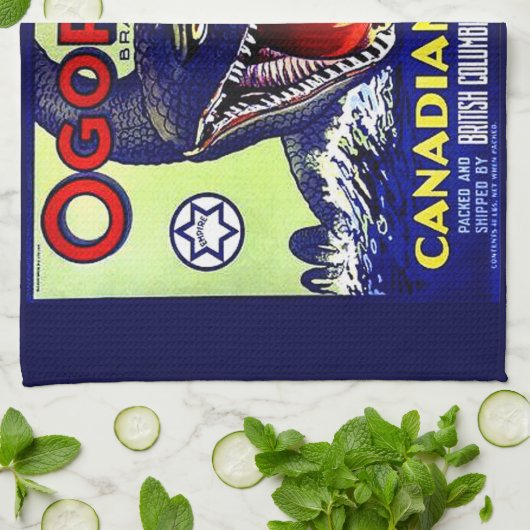 Ogopogo Kanadischer Äpfel Obstkarton Geschirrtuch (Gefaltet)