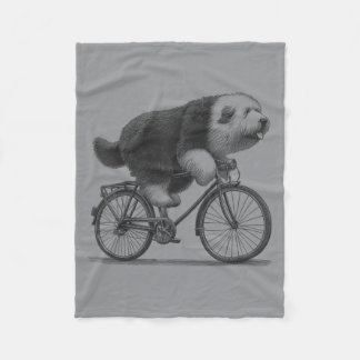 Old English Sheepdog fährt Fahrrad Fleecedecke