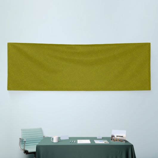 Olive green surface with subtle swirling pattern banner (Messeveranstaltung)