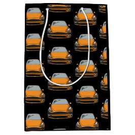 Orange Elektrofahrzeug SUV Auto schwarzer Hintergr Mittlere Geschenktüte