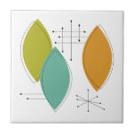 Orange Green Tuquoise Surfboard Formen Mitte Jahrh Fliese<br><div class="desc">Diese trendige,  moderne Keramik mit ihren türkisfarbenen,  grünen und orangefarbenen Ornamenten und den schwarzen Sternexplosionen verleiht Ihrem Fliesenprojekt oder einem Akzent einen ganz besonderen Touch.</div>