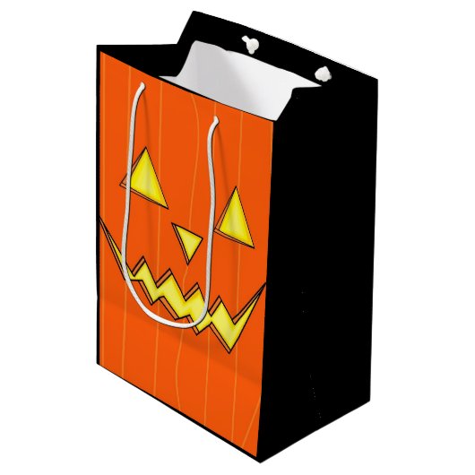 Orange Jack-o-Lantern-Geschenktasche zu Halloween  Mittlere Geschenktüte (Vorderseite Schrägansicht)