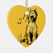 Orange Katze des niedlichen Gesangs, die mit Keramikornament (Rechts)