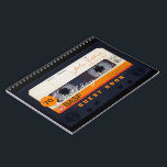 Orange Retro Audiotape 70th birthday Guest Book Notizblock<br><div class="desc">Old Audio Kassette to personalize with your name and date. Design on spiral notebook with text for 70th Birthday party guest book in horizontal guidance. You can easily change text (machen, mitbewohner, size and position) by clicking the customize button. In hard cover guest book. Matching birthday save the date postcard...</div>