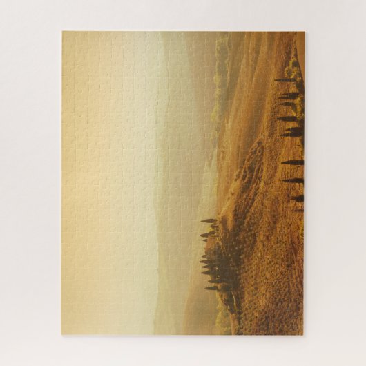 Orange Sonnenaufgang über einer Landschaft in Puzzle (Vertikal)