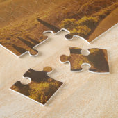 Orange Sonnenaufgang über einer Landschaft in Puzzle (Seite)