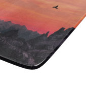 Orange Sunset Bird in Sky Schneidebrett (Ecke)