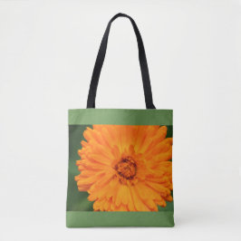 Orange und grüne Tasche der wild lebenden Blume