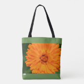 Orange und grüne Tasche der wild lebenden Blume (Rückseite)