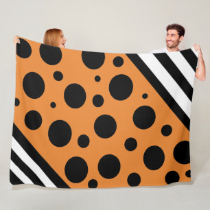 Orange und schwarze Punkte und Streifen Decke