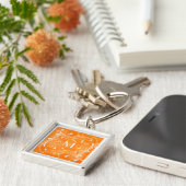 Orange und weißer schlüsselanhänger (Seite)