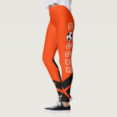 Orange, weißer und schwarzer Fußball-Spieler Leggings (Links)