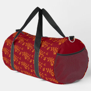 Orangefarbene Blätter der Silhouette auf rot Duffle Bag