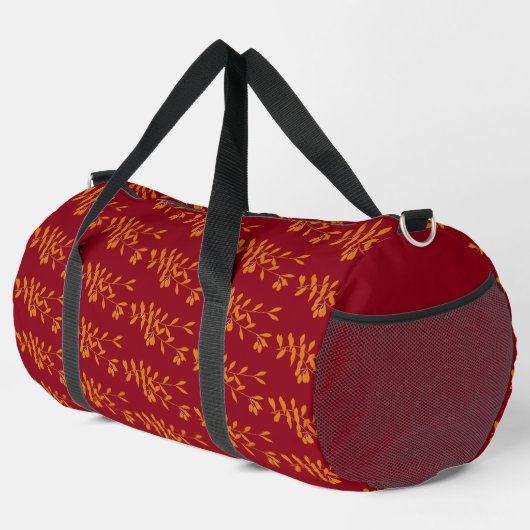 Orangefarbene Blätter der Silhouette auf rot Duffle Bag (Rechte Ecke)
