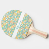 Orangefarbene Blume auf grün Tischtennis Schläger (Seitenansicht)