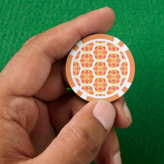 Orangefarbene Blume, Muster von Blume, Muster von Pokerchips (Hand)