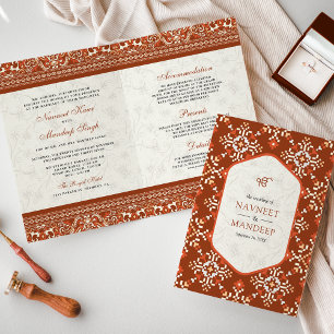 Orangefarbene Kreuzstiche in einer Sikh-Hochzeit Einladung