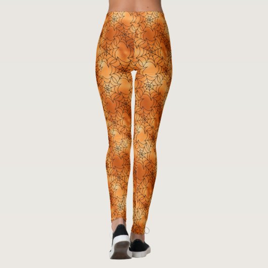 Orangefarbene Kupfer-Leggings mit schwarzen Kobele Leggings (Rückseite)