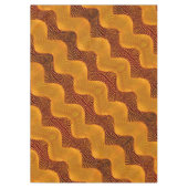 Orangefarbene Kurve und goldene Punkte auf braunem Tischdecke (Vorderseite)