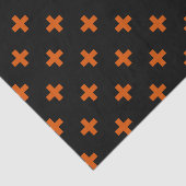 Orangefarbene Polka-Kreuze auf schwarz Seidenpapier (Ausschnitt)