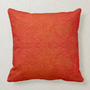 Orangefarbene rote Imitate Ledermuster mit Blumenm Kissen